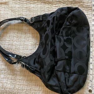 Black Coach purse 2 straps, red lining,